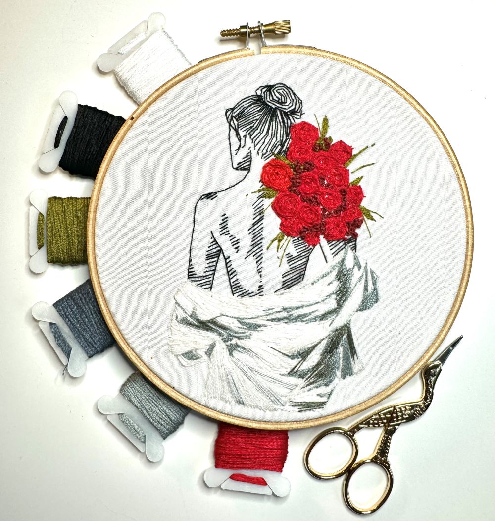female embroidery kit with scissors and DMC threads