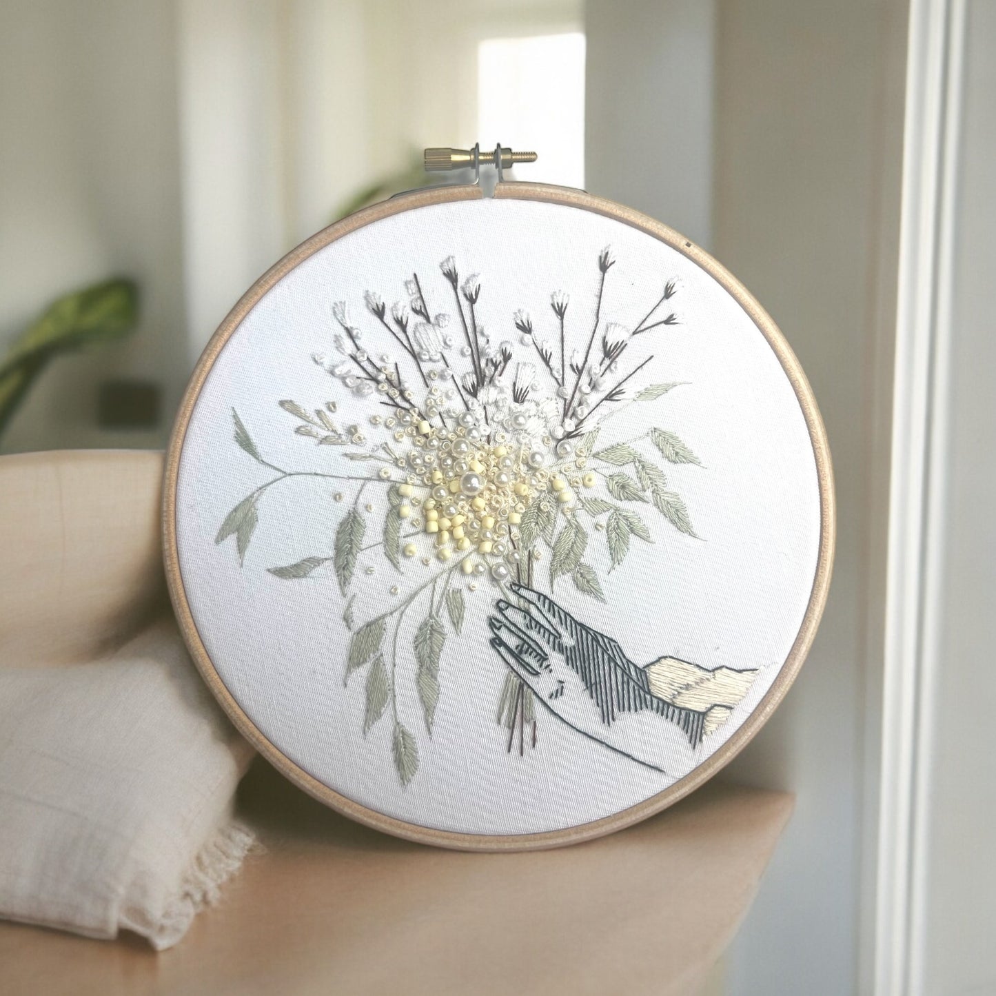 white flower embroidery in cosy interior