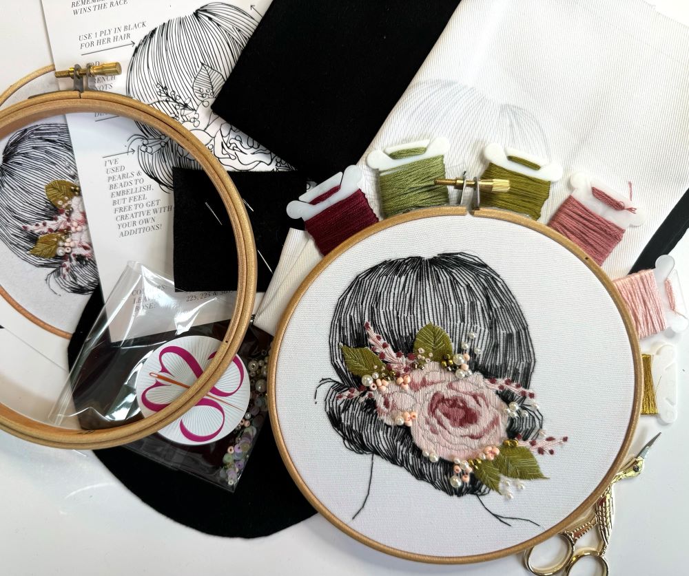 pink and green flower embroidery kit with wooden hoop scissors and DMC thread