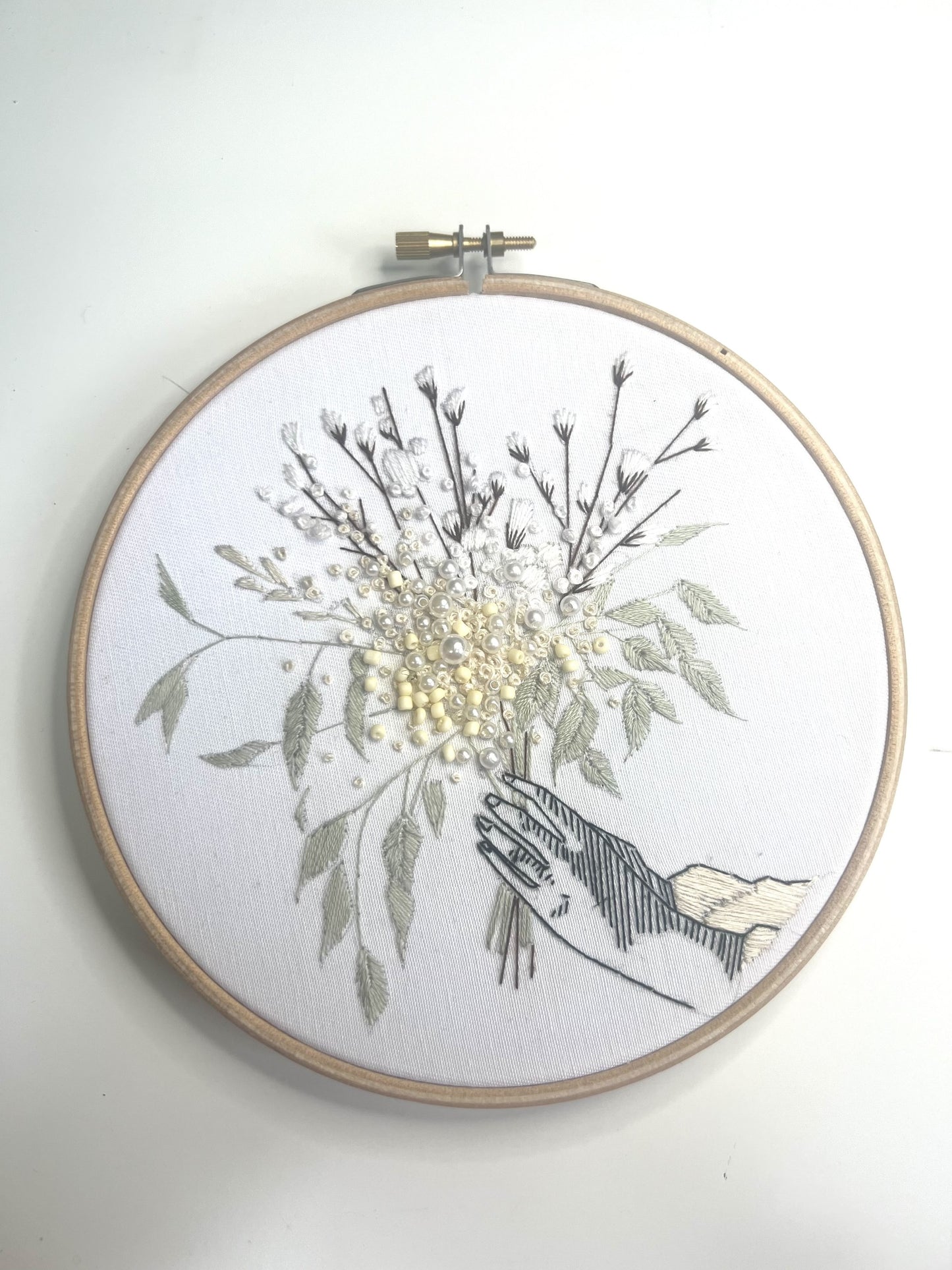 winter floral embroidery pattern against white wall